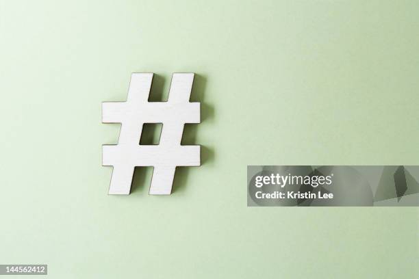 hashtag on white background, studio shot - hashtag stock pictures, royalty-free photos & images