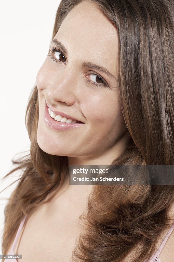 Portrait of smiling woman,  studio shot