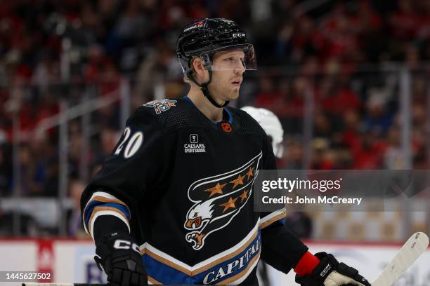 Lars Eller of the Washington Capitals gets set for a face-off during a game against the Calgary Flames at Capital One Arena on November 25, 2022 in...