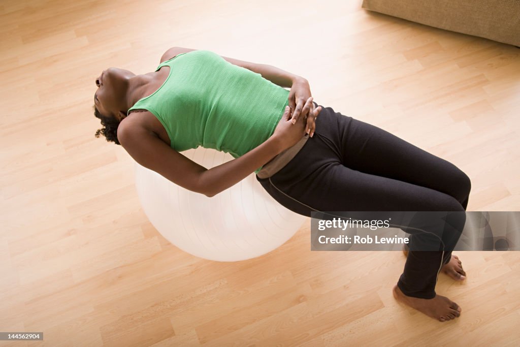 USA, California, Los Angeles, Woman lying on fitness ball
