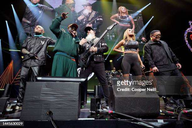 Taboo, will.i.am, George Pajon, J. Rey Soul, and APL.DE.AP of Black Eyed Peas perform onstage during iHeartRadio 106.1 KISS FM's Jingle Ball 2022...