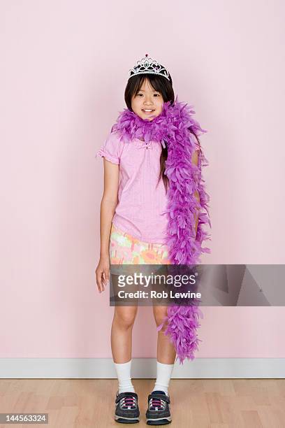 studio shot portrait of teenage girl in diadem and feather boa shawl, full length - feather boa stock pictures, royalty-free photos & images