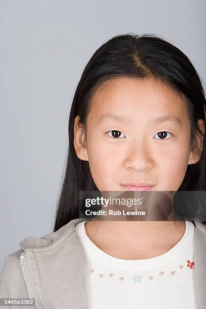 studio shot portrait of teenage girl, head and shoulders - studio head shot serious confident looking at camera imagens e fotografias de stock