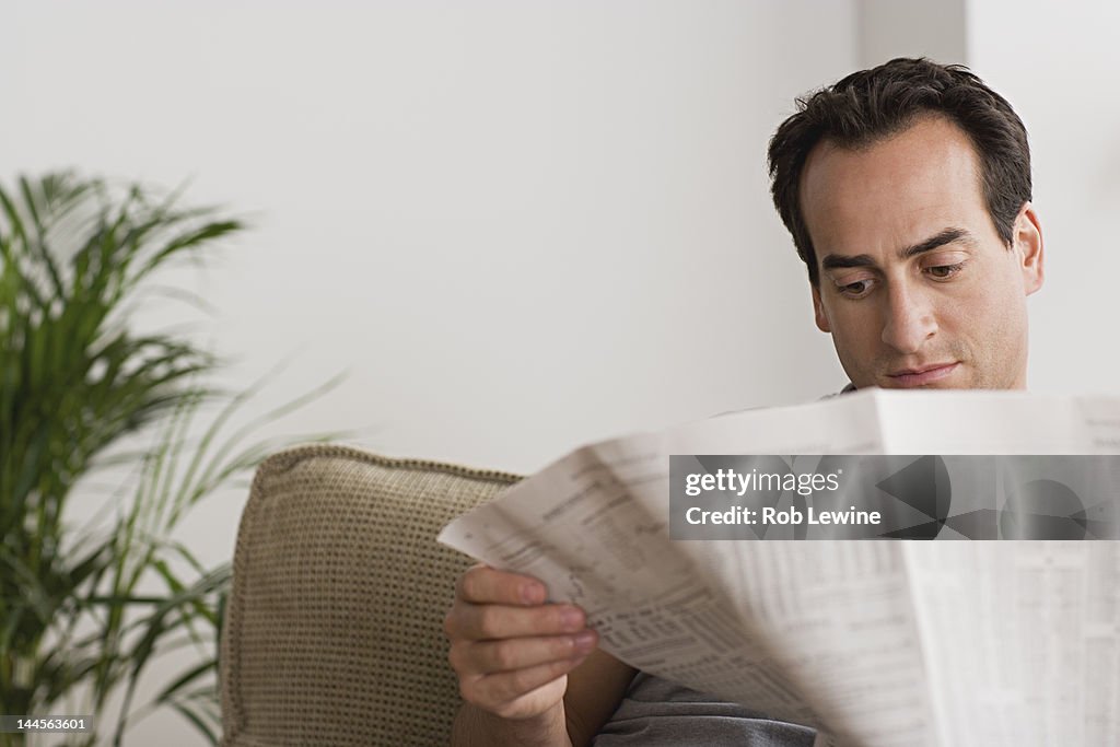 USA, California, Los Angeles, Man reading newspaper