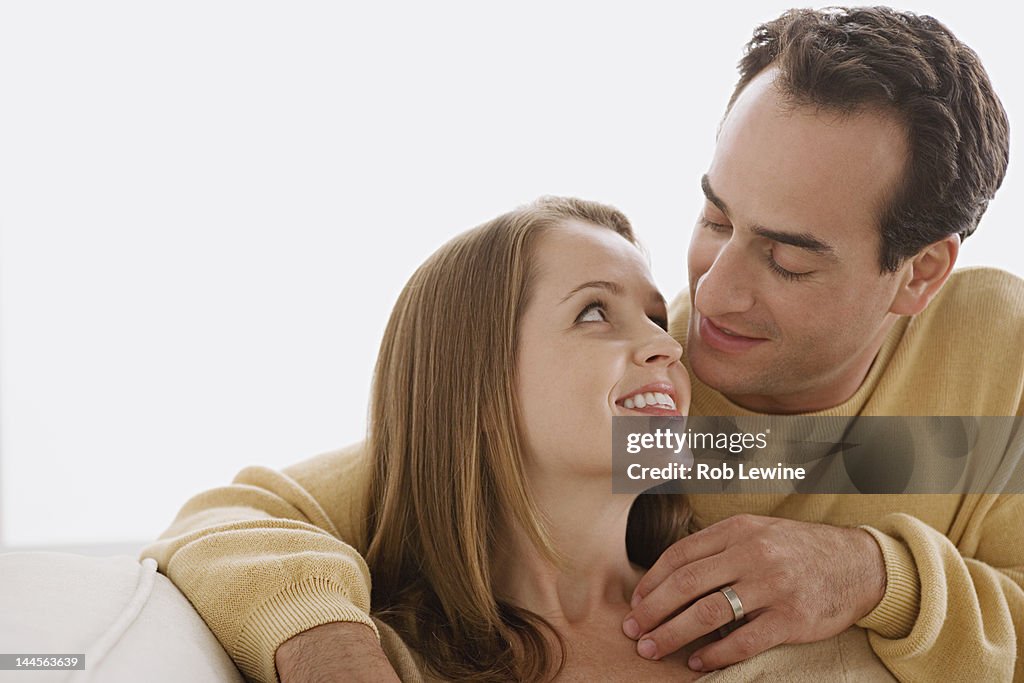USA, California, Los Angeles, Married couple in close embrace looking at each other