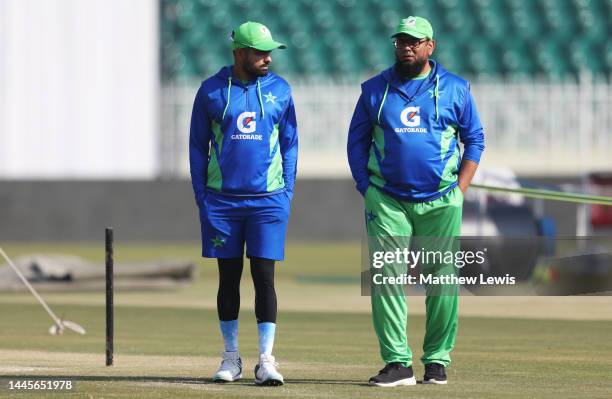 Babar Azam of Pakistan pictured with Saqlain Mushtaq, Head Coach of Pakistan during a Net Session ahead of the First Test match at Rawalpindi Cricket...