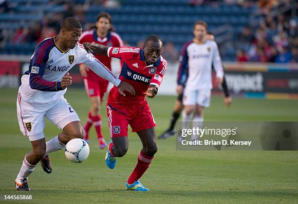 Dominic Oduro of the Chicago Fire and Chris Schuler of Real Salt Lake go for the ball at Toyota Park on May 9, 2012 in Bridgeview, Illinois. The Fire...