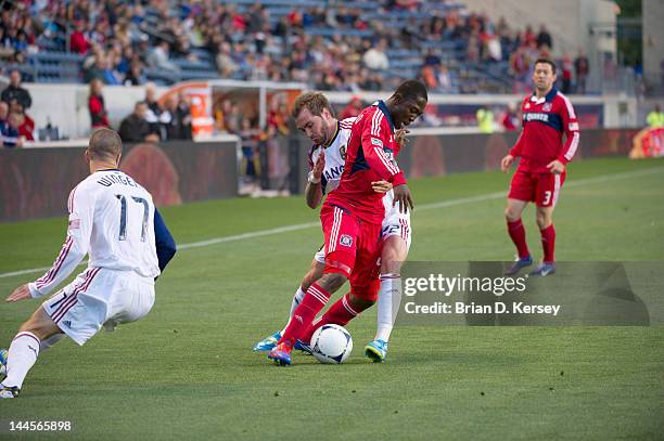 Patrick Nyarko of the Chicago Fire moves the ball up the field as Jonny Steele of Real Salt Lake defends at Toyota Park on May 9, 2012 in Bridgeview,...