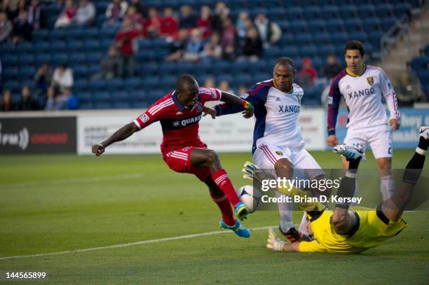 Dominic Oduro of the Chicago Fire tries to score as goalkeeper Kyle Reynish and Jamison Olave of Real Salt Lake defend at Toyota Park on May 9, 2012...