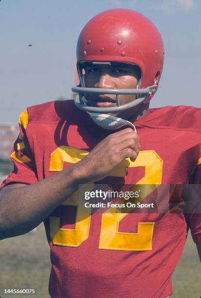 Simpson of the University of Southern California Trojans looks on from the sidelines during an NCAA college football game circa 1968. Simpson played...