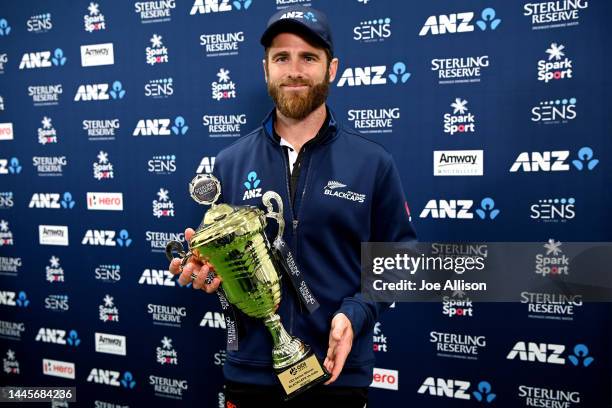 Kane Williamson of New Zealand poses for a photo with the series trophy following game three of the One Day International series between New Zealand...