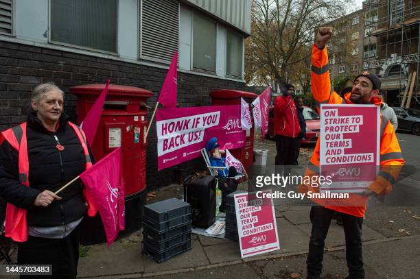 Striking CWU members attend their picket line at the Camden mail centre on November 30, 2022 in London, United Kingdom. The strikes went ahead after...