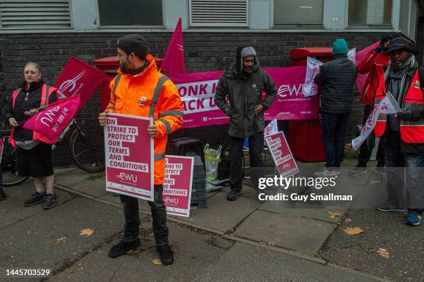 Striking CWU members attend their picket line at the Camden mail centre on November 30, 2022 in London, United Kingdom. The strikes went ahead after...
