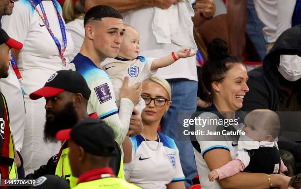 Phil Foden of England with his wife Rebecca Cooke following the FIFA World Cup Qatar 2022 Group B match between Wales and England at Ahmad Bin Ali...