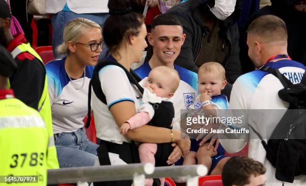 Phil Foden of England with his wife Rebecca Cooke following the FIFA World Cup Qatar 2022 Group B match between Wales and England at Ahmad Bin Ali...