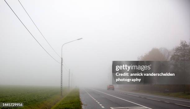tarred road and agricultural field - fog stock pictures, royalty-free photos & images