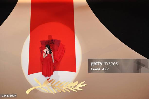 French actress Berenice Bejo arrives on stage to host the opening ceremony of the 65th Cannes film festival on May 16, 2012 in Cannes. AFP PHOTO /...