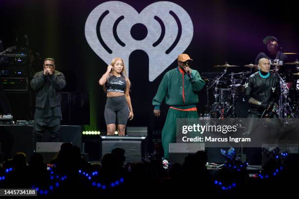 Apl.de.ap, will.i.am and Taboo of Black Eyed Peas perform on stage during the 106.1 KISS FM's Jingle Ball concert at Dickies Arena on November 29,...