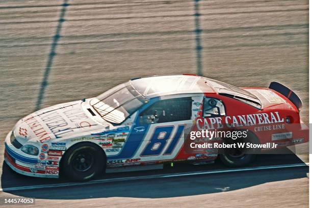 Cape Canaveral Cruise Line's car slows for a pit stop during the Winston Cup Race at the Charlotte Motor Speedway, Charlotte, North Carolina, 1997.