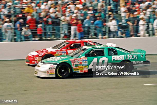 The First Union and RCA cars on the track during the Winston Cup Race at the Charlotte Motor Speedway, Charlotte, North Carolina, 1997.