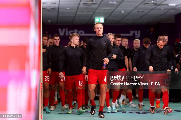 Simon Kjaer and Denmark players walk out for the warm up prior to the FIFA World Cup Qatar 2022 Group D match between Australia and Denmark at Al...