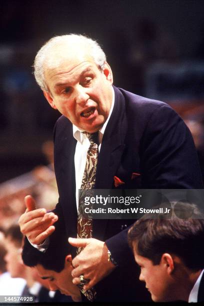 American basketball coach Rollie Massimino of Villanova University talks from the bench during a game against the University of Connecticut,...