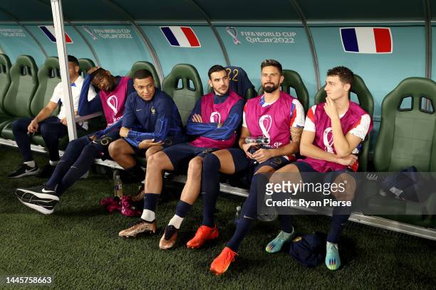 Kylian Mbappe of France and teammates look on from the bench prior to the FIFA World Cup Qatar 2022 Group D match between Tunisia and France at...