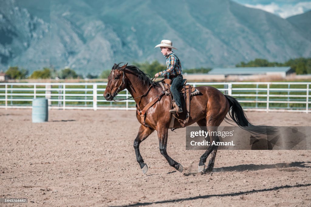 Still Hoarse And Rodeo Rider Image Young Cowboy Riding A Horse In A Rodeo Arena High-Res Stock Photo ...