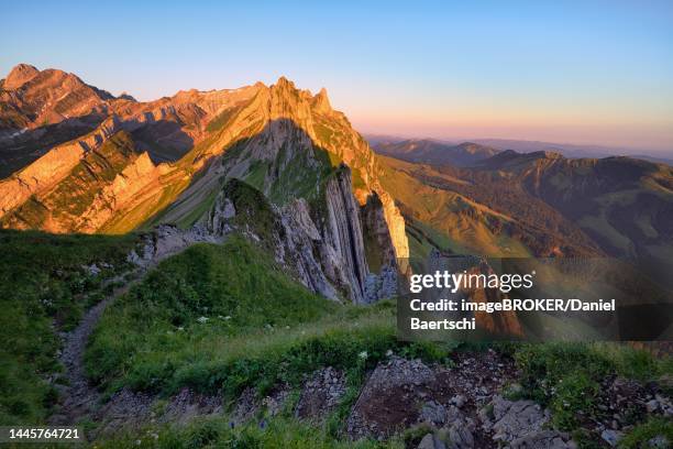 view of the alpstein mountains in appenzell from the mountain hiking trail, cloudless sky in the morning light, canton of appenzell innerrhoden, switzerland - appenzell innerrhoden stock pictures, royalty-free photos & images