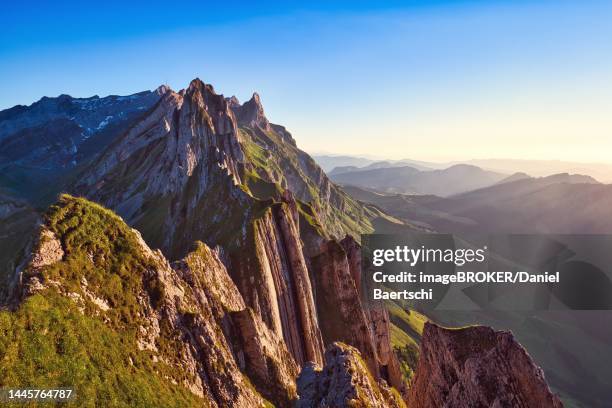 alpstein mountains with ridge in the evening light, cloudless sky over appenzellerland, canton appenzell innerrhoden, switzerland - appenzell innerrhoden stock pictures, royalty-free photos & images