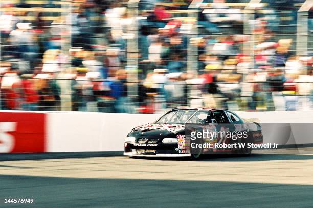 Sterling Cowboy's car on the track at the Watkins Glen International raceway, Watkins Glen, New York, 1997.