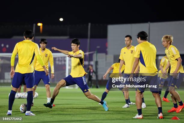 Takehiro Tomiyasu of Japan trains with teammates during the Japan Training Session at Al Sadd SC New Training Facilities on November 30, 2022 in...