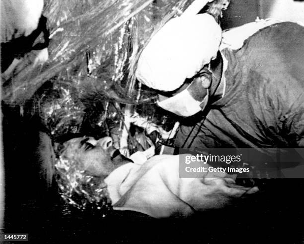 South African heart surgery pioneer Doctor Christian Barnard examines the progress of his patient Louis Washkansky, the first man to survive a heart...