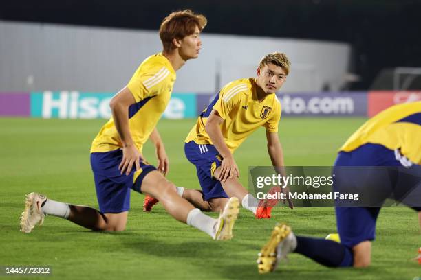 Ritsu Doan of Japan stretches during the Japan Training Session at Al Sadd SC New Training Facilities on November 30, 2022 in Doha, Qatar.