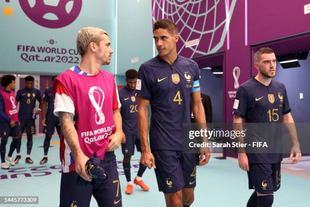 Antoine Griezmann, Raphael Varane and Jordan Veretout of France prepare to enter the pitch for the second half during the FIFA World Cup Qatar 2022...