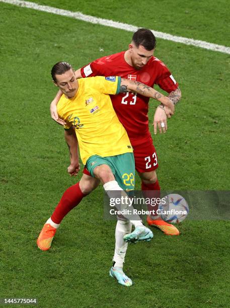 Jackson Irvine of Australia controls the ball under pressure of Pierre-Emile Hojbjerg of Denmark during the FIFA World Cup Qatar 2022 Group D match...