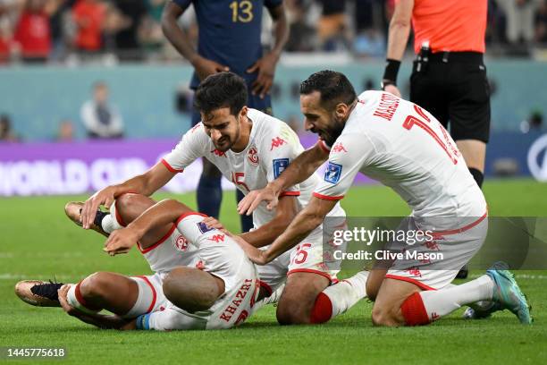 Wahbi Khazri of Tunisia celebrates with teammates after scoring their team's first goal during the FIFA World Cup Qatar 2022 Group D match between...