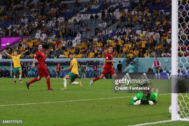 Mathew Leckie of Australia looks over his shoulder as the ball passes Kasper Schmeichel of Denmark to give the side a 1-0 lead during the FIFA World...