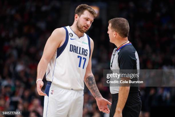 Luka Doncic of the Dallas Mavericks talks with referee Brent Barnaky during the second half of their NBA game against the Toronto Raptors at...