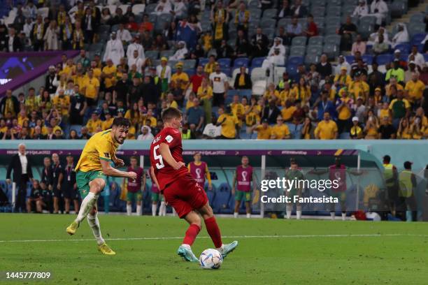 Mathew Leckie of Australia fires the ball past Kasper Schmeichel of Denmark to give the side a 1-0 lead during the FIFA World Cup Qatar 2022 Group D...