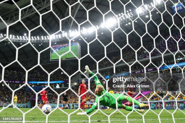 Mathew Leckie of Australia scores their team's first goal past Kasper Schmeichel of Denmark during the FIFA World Cup Qatar 2022 Group D match...