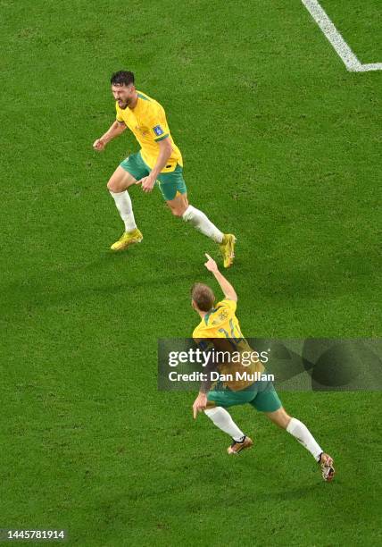 Mathew Leckie of Australia celebrates after scoring their team's first goal with their teammate Riley McGree during the FIFA World Cup Qatar 2022...