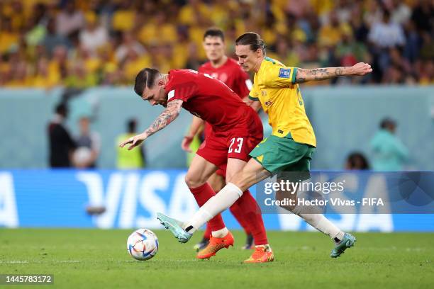 Pierre-Emile Hojbjerg of Denmark and Jackson Irvine of Australia compete for the ball during the FIFA World Cup Qatar 2022 Group D match between...