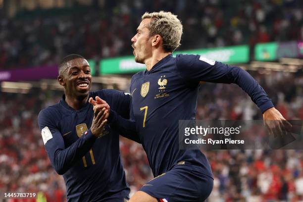 Antoine Griezmann of France celebrates with Ousmane Dembele after scoring their team's first goal during the FIFA World Cup Qatar 2022 Group D match...