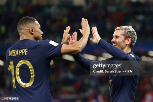 Antoine Griezmann of France celebrates with Kylian Mbappe after scoring a goal that was ruled offside after a Video Assistant Referee reviewduring...