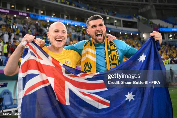Aaron Mooy and Mathew Ryan of Australia celebrate after the 1-0 win during the FIFA World Cup Qatar 2022 Group D match between Australia and Denmark...