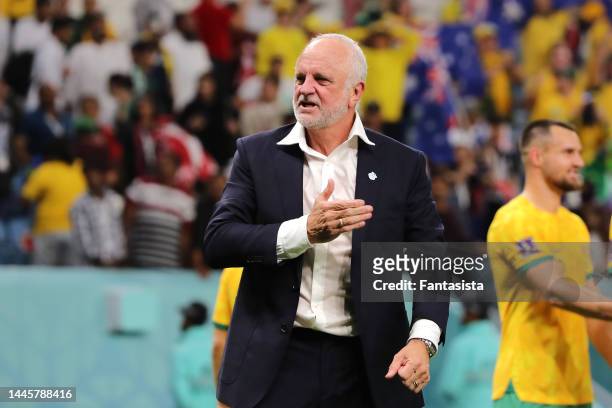 Graham Arnold Head coach of Australia celebrates the 1-0 victory and the team's passage to the knockout stages following the final whistle of the...