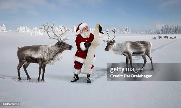 santa clause and the christmas wish list - a reindeer ストックフォトと画像