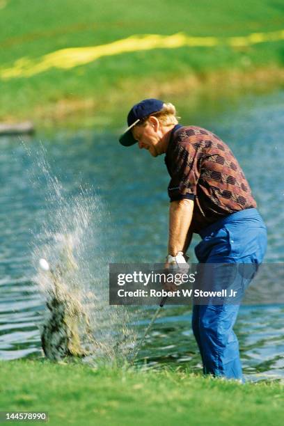 American golfer Jack Nicklaus in the water during the PGA Seniors' Championship at the PGA National Golf Club, Palm Beach Gardens, Florida, 1996.