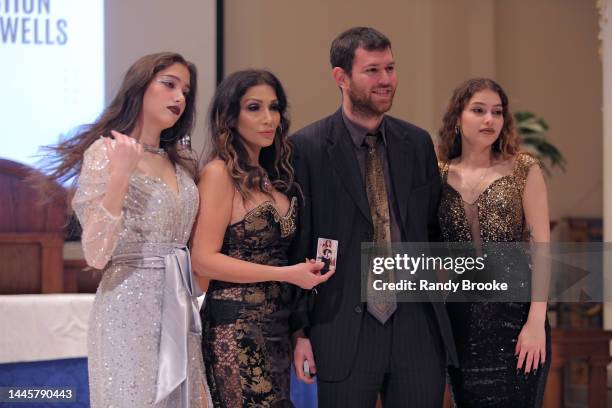 Farzana, her daughters and Magician Josh Pele pose during The Farzana Foundation: The Givers Holiday Gala providing funding for the construction of...